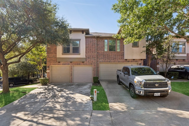 townhome / multi-family property featuring a garage