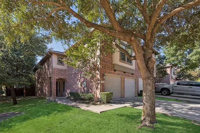 view of front of home featuring a front yard and a garage