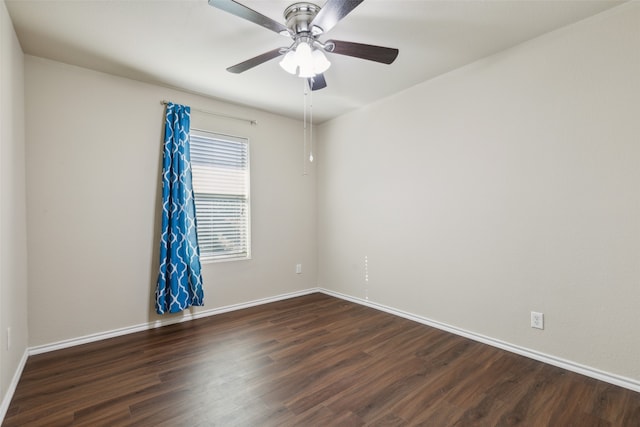 spare room featuring ceiling fan and dark hardwood / wood-style flooring