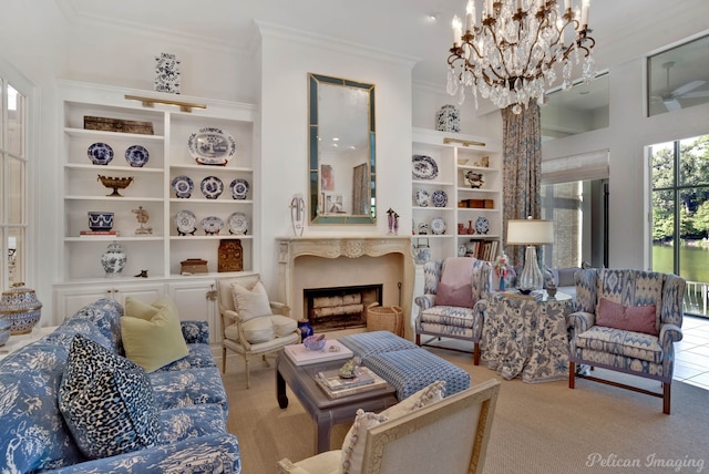 carpeted living room with crown molding, built in shelves, and an inviting chandelier