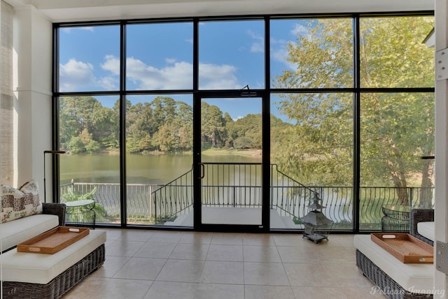 interior space with a water view and a healthy amount of sunlight