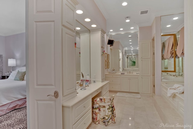 bathroom with ornamental molding, a washtub, tile patterned floors, and vanity