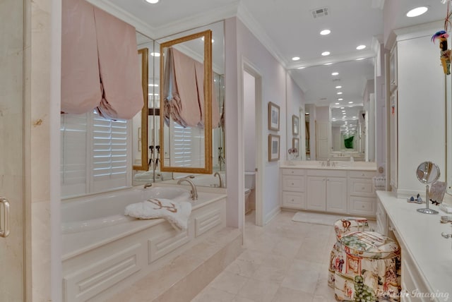 bathroom with tiled tub, crown molding, and vanity