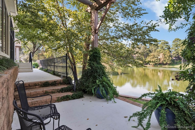 view of patio with a water view