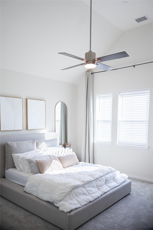 carpeted bedroom featuring ceiling fan and lofted ceiling