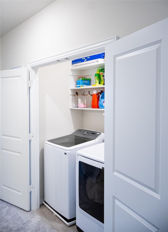 laundry room with independent washer and dryer