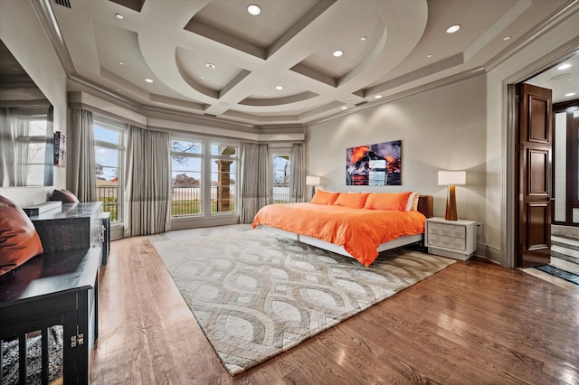 bedroom with wood-type flooring, beam ceiling, and coffered ceiling