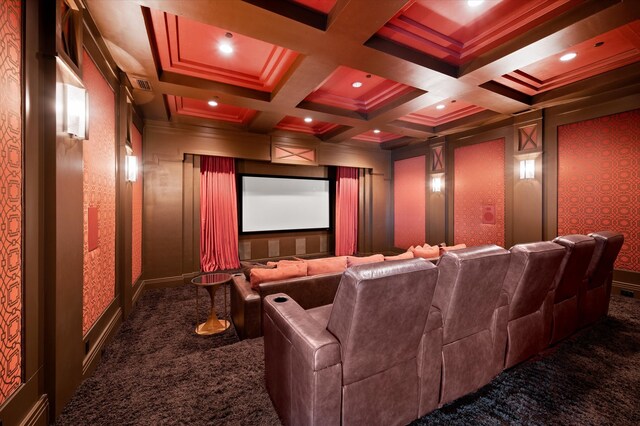 carpeted home theater room featuring ornamental molding, coffered ceiling, and beam ceiling