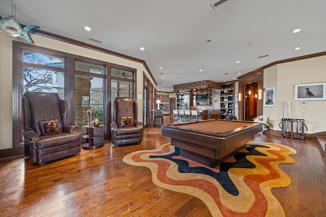 rec room with bar area, billiards, dark hardwood / wood-style floors, and ornamental molding