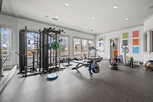 exercise room featuring ornamental molding