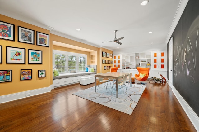 dining space with built in shelves, crown molding, hardwood / wood-style floors, and ceiling fan