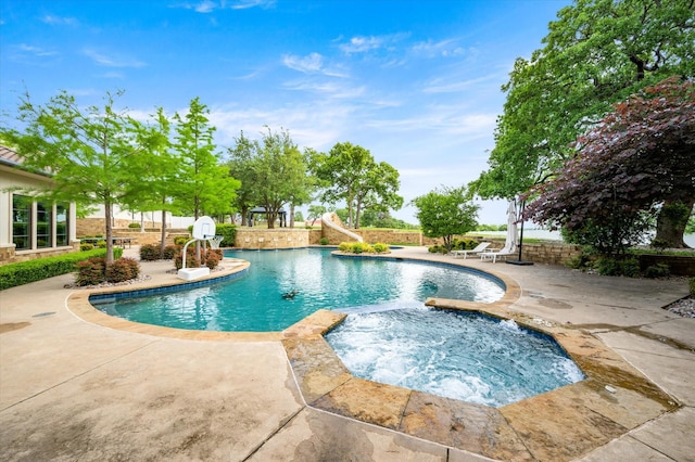 view of swimming pool with a patio area