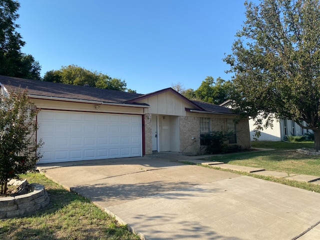 single story home with a garage and a front yard