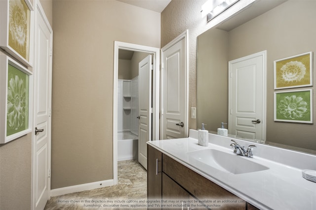 bathroom with vanity and washtub / shower combination