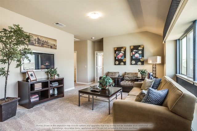 living room featuring lofted ceiling and carpet flooring