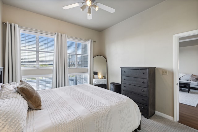 bedroom with light carpet and ceiling fan