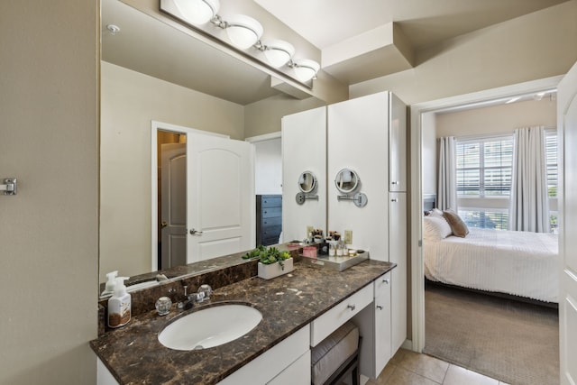 bathroom with tile patterned flooring and vanity