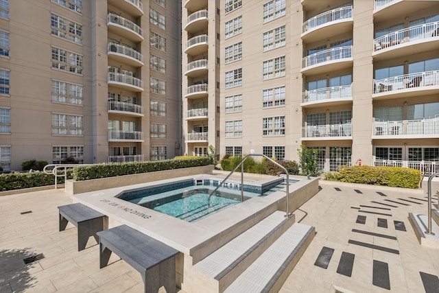 view of pool featuring a community hot tub