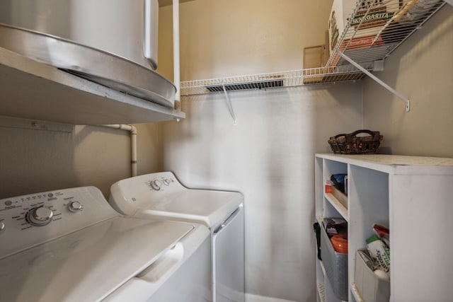 laundry area with washing machine and clothes dryer