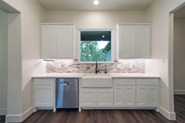 kitchen with sink, white cabinetry, stainless steel dishwasher, and dark hardwood / wood-style flooring