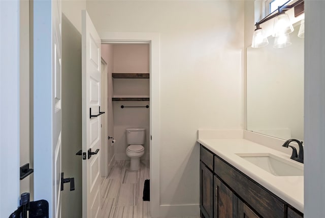 bathroom with vanity and toilet