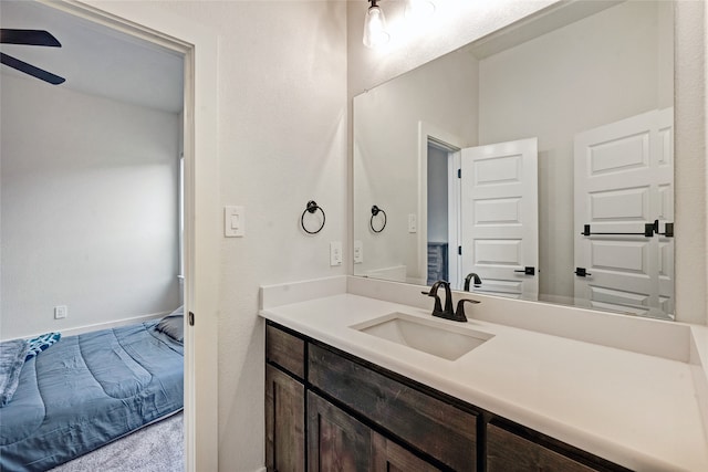 bathroom featuring ceiling fan and vanity