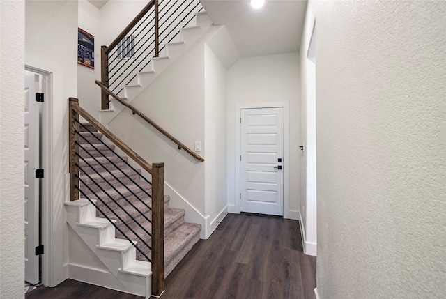 stairway featuring hardwood / wood-style flooring