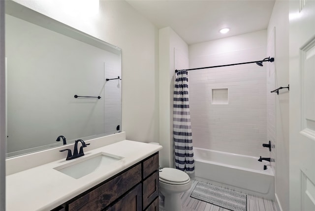 full bathroom with shower / tub combo, tile patterned floors, vanity, and toilet