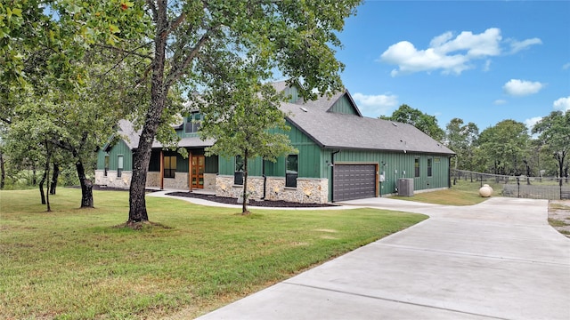 view of front facade with a front yard and a garage