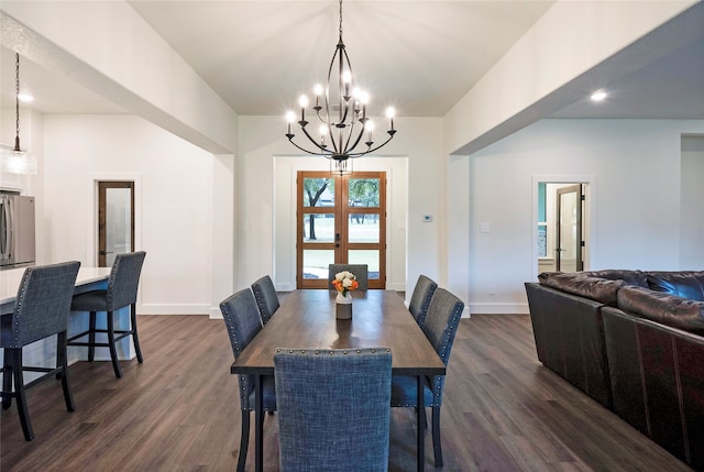 dining area featuring french doors, a chandelier, and dark hardwood / wood-style flooring