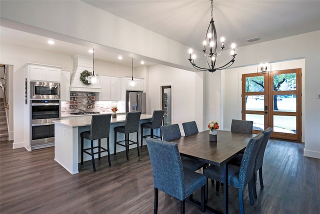 dining space with french doors and dark hardwood / wood-style flooring