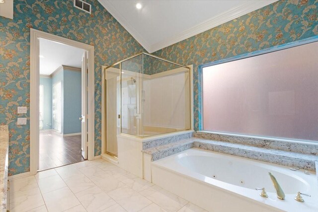 bathroom featuring ornamental molding and shower with separate bathtub