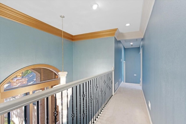 hall with crown molding and carpet flooring