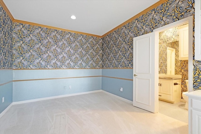 unfurnished room featuring crown molding and light carpet