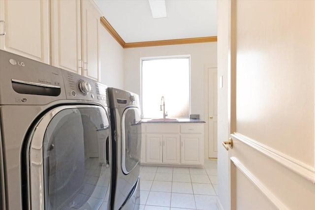 laundry room with sink, crown molding, cabinets, washer and dryer, and light tile patterned floors