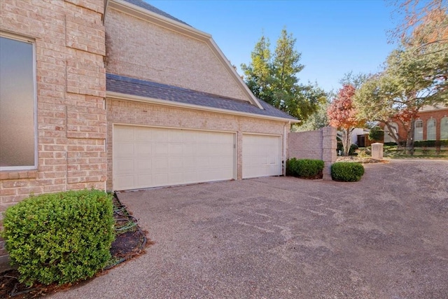 view of side of property with a garage