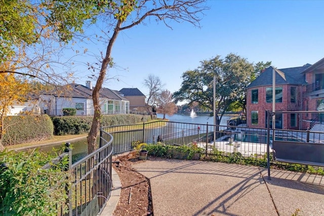 view of home's community featuring a water view