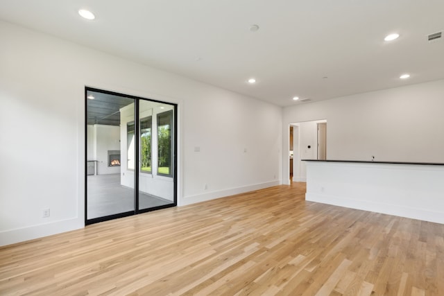 spacious closet with light hardwood / wood-style flooring