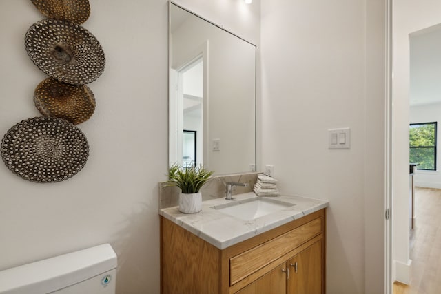 washroom with washer hookup, cabinets, and dark tile patterned floors