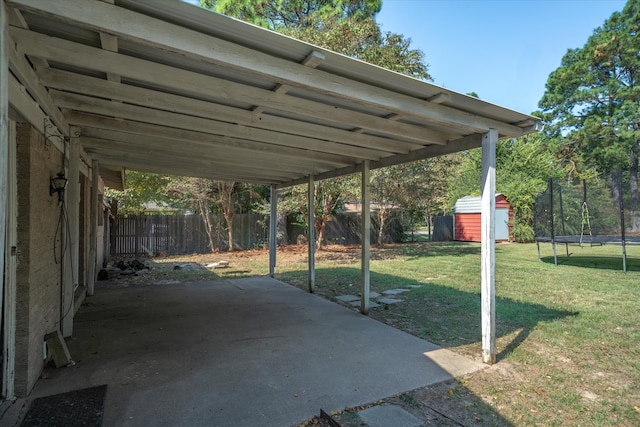 view of patio featuring a storage shed and a trampoline