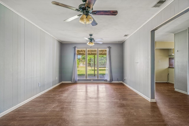 spare room featuring ornamental molding, ceiling fan, and dark hardwood / wood-style floors