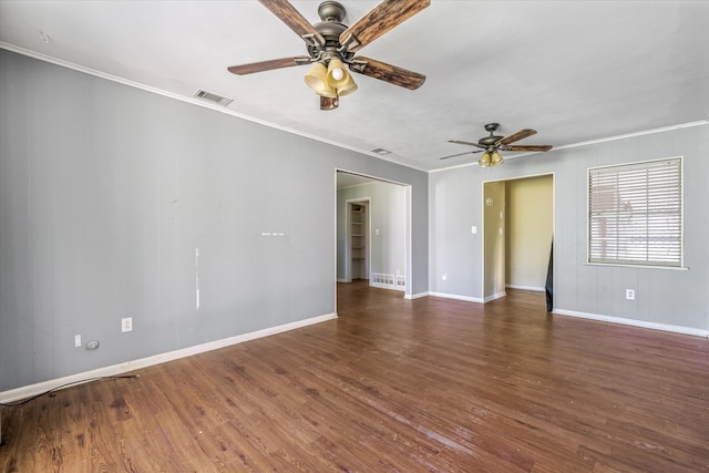 empty room featuring crown molding, dark hardwood / wood-style flooring, and ceiling fan