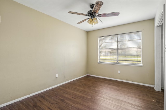 empty room with ceiling fan and wood-type flooring