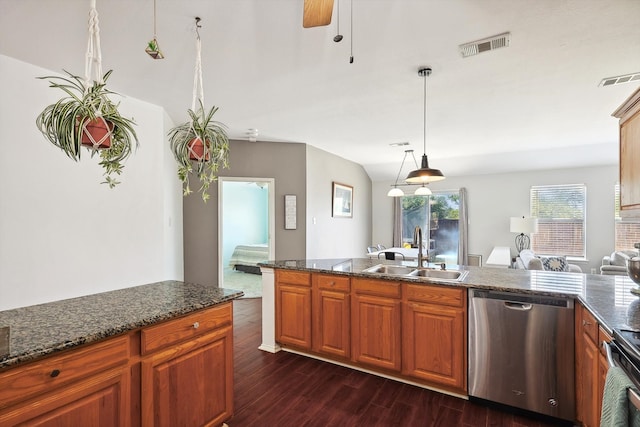 kitchen featuring ceiling fan, dark hardwood / wood-style floors, sink, stainless steel appliances, and hanging light fixtures