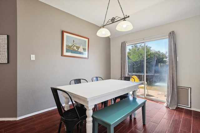 dining area with dark hardwood / wood-style floors