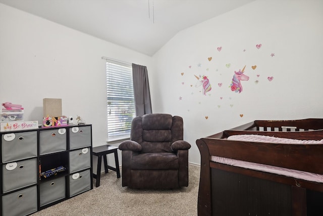 bedroom with light colored carpet and lofted ceiling