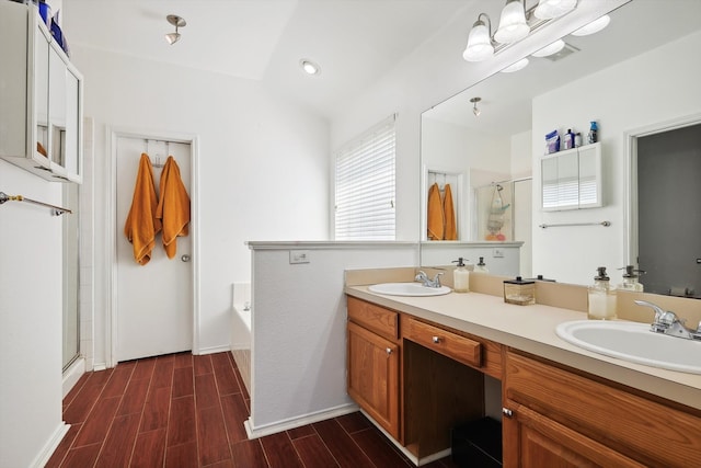 bathroom featuring vanity, plus walk in shower, and hardwood / wood-style flooring