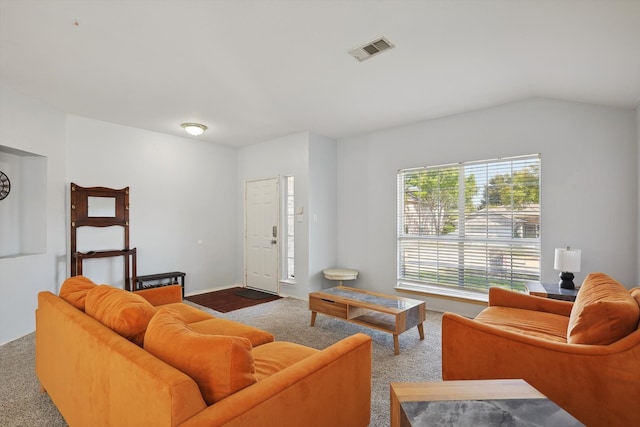 living room with lofted ceiling and carpet