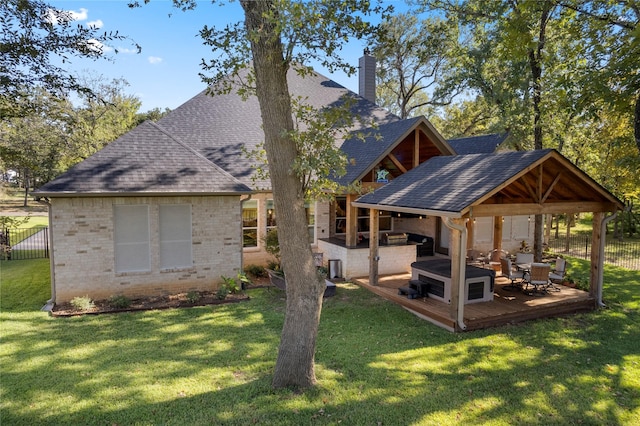 rear view of house with a gazebo, an outdoor hangout area, a patio, and a lawn