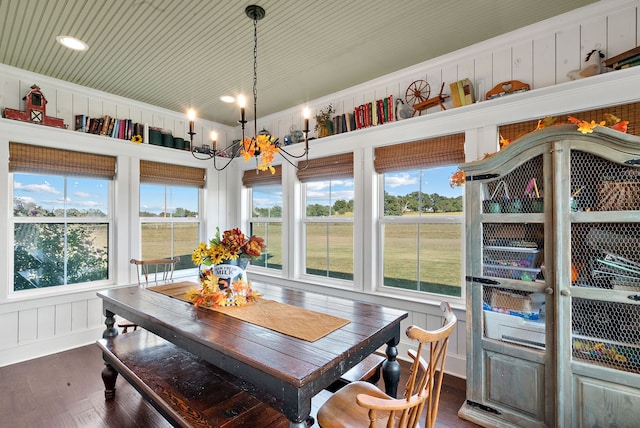 sunroom / solarium with an inviting chandelier and a healthy amount of sunlight